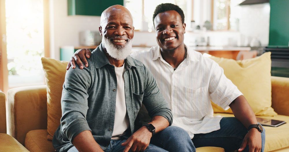 Father and son smiling with healthy teeth after dental Implants