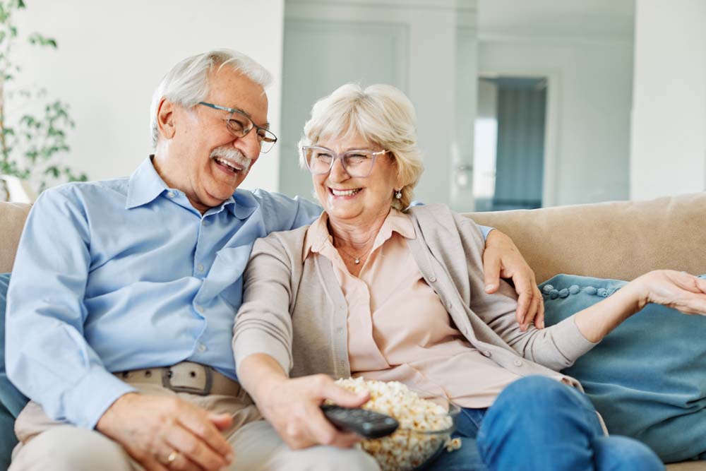 Happy couple enjoying healthy smiles and quality dental Implants