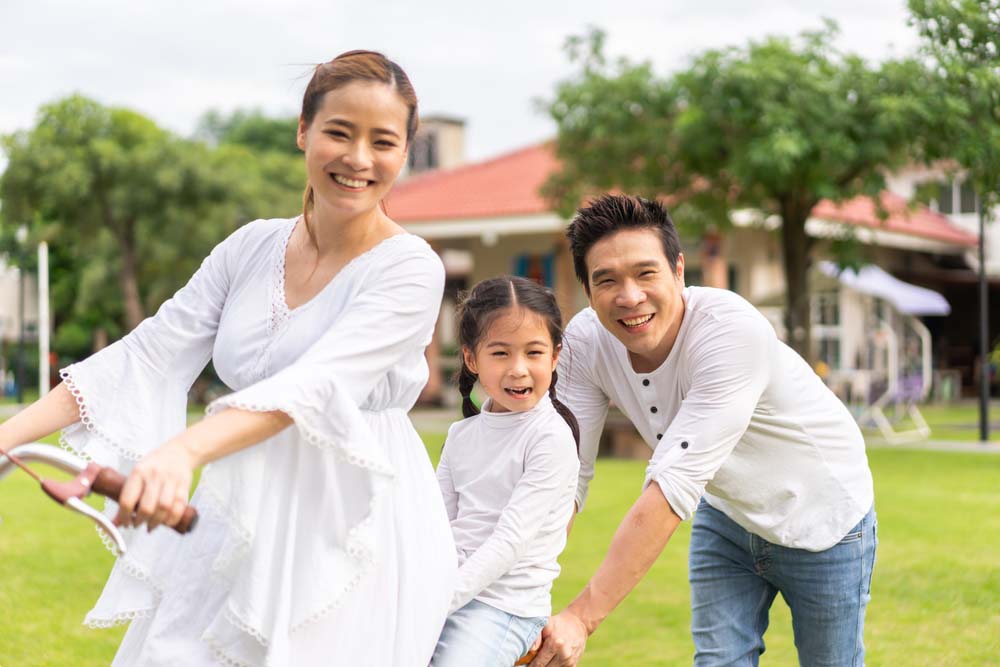 Family enjoying healthy smiles and outdoor activities after General Dentistry in Livonia, MI