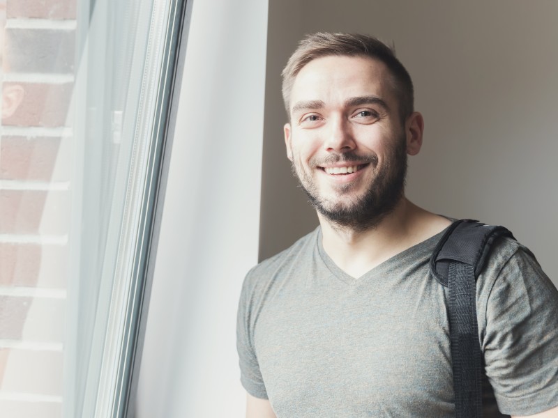 Smiling patient showing confidence after Dental Veneers
