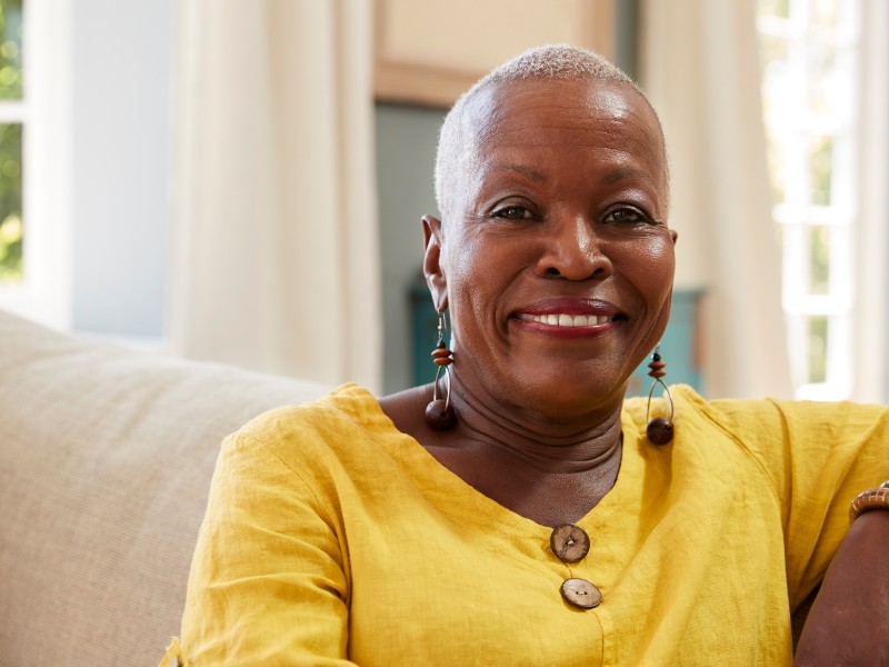 woman smiling confidently with healthy teeth and dental care results after Dentures and teeth repairs
