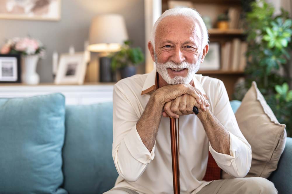 man smiling confidently with healthy teeth after Periodontal Treatment