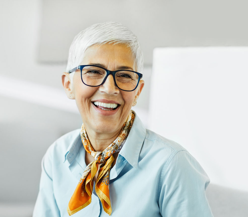 woman smiling confidently with healthy teeth after dental care