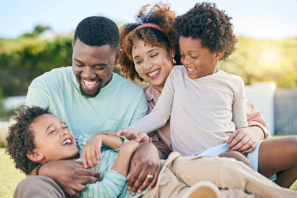 Happy family enjoying healthy smiles after visiting the dentist
