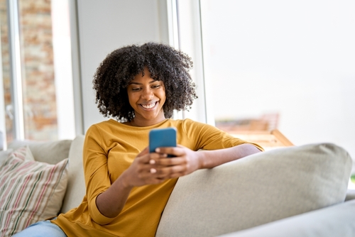 Woman scheduling dental appointment online from home