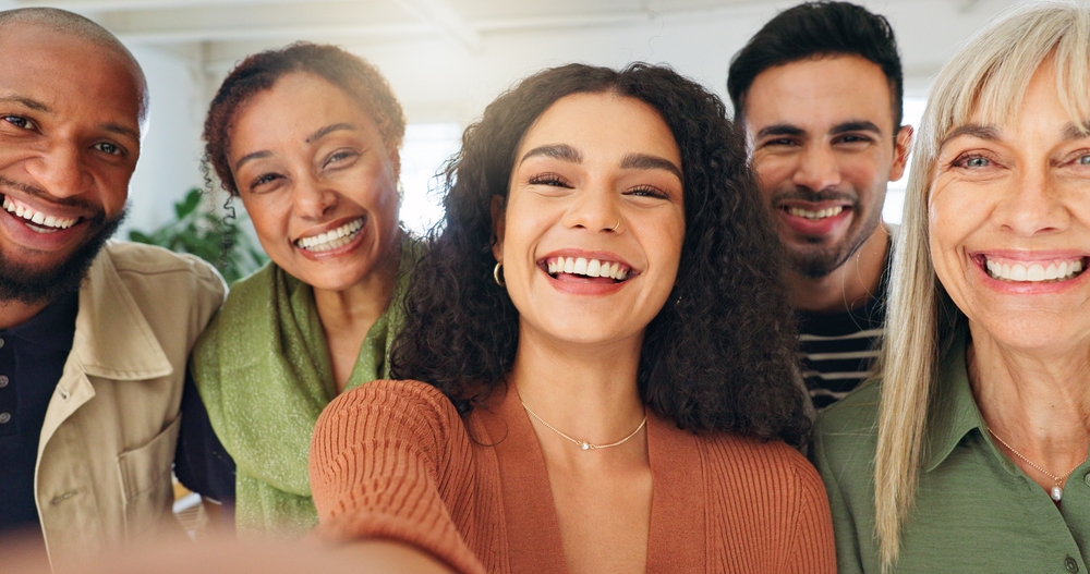 Smiling patients showing healthy teeth after cosmetic dental treatments