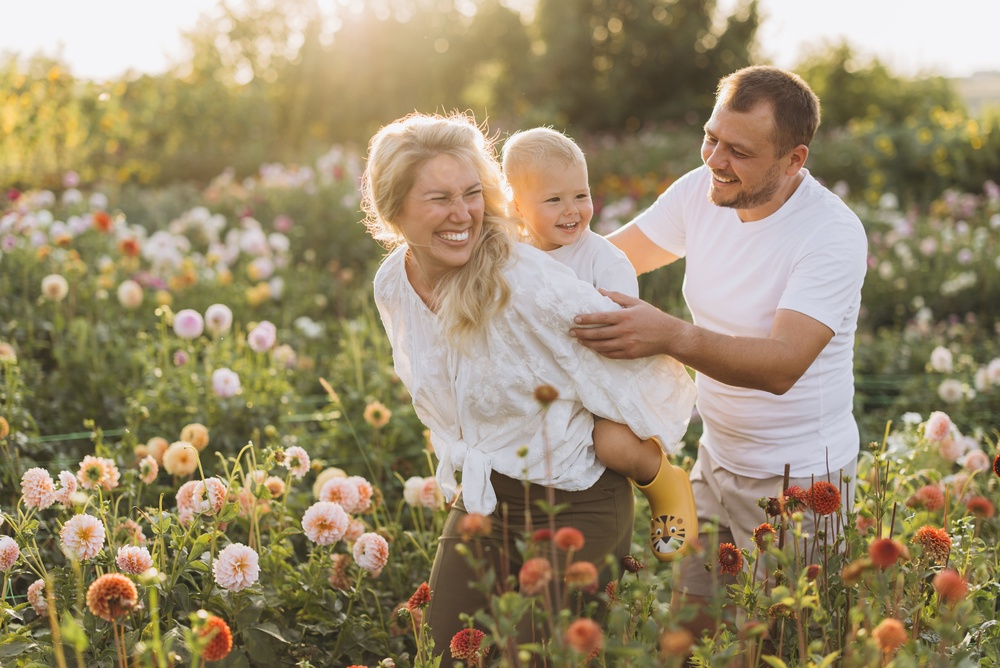 Happy family outdoors enjoying healthy smiles after General Dentistry care